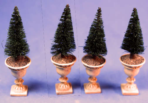 Set of 4 shrubs in urns - Click Image to Close