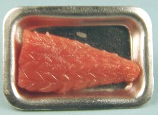 Salmon fillets uncooked in metal tray