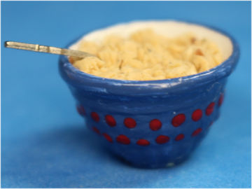 Bowl of oatmeal with spoon - blue bowl