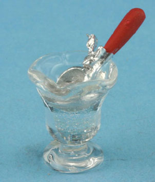 Ice cream scoop in dish of water