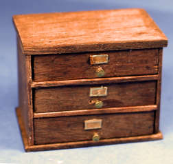 Small storage cabinet with labels