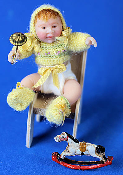 (image for) Baby doll with chair, toy rocking horse and rattle