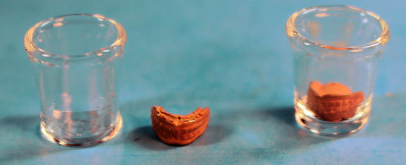 False teeth in a glass