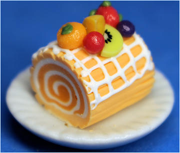 Orange log cake with fruit