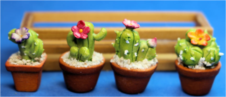 Porcelain cactus in wood planter