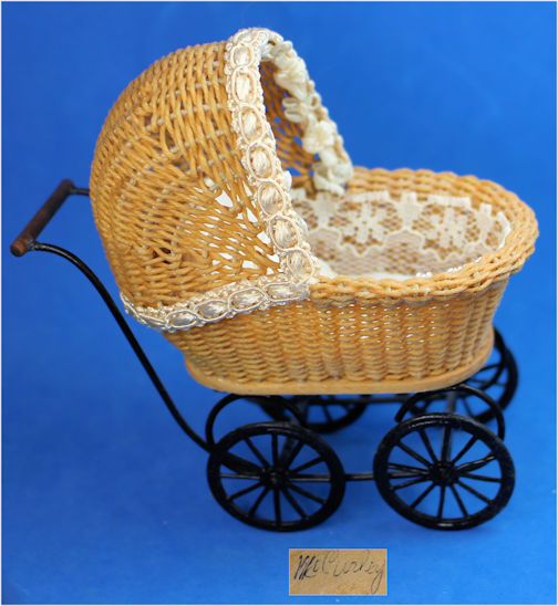 Wicker baby carriage by McCurley - Click Image to Close