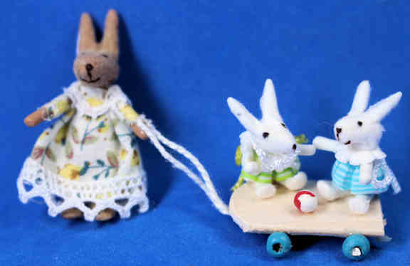 Momma rabbbit pulling babies - child's toy (image for) Momma rabbbit pulling babies - child's toy