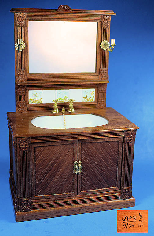 Bathroom sink with mirror and hand painted ceramic tiles