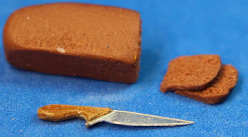 (image for) Whole wheat bread loaf with slices and knife