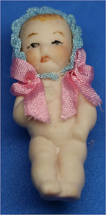 Porcelain doll with hat - Click Image to Close